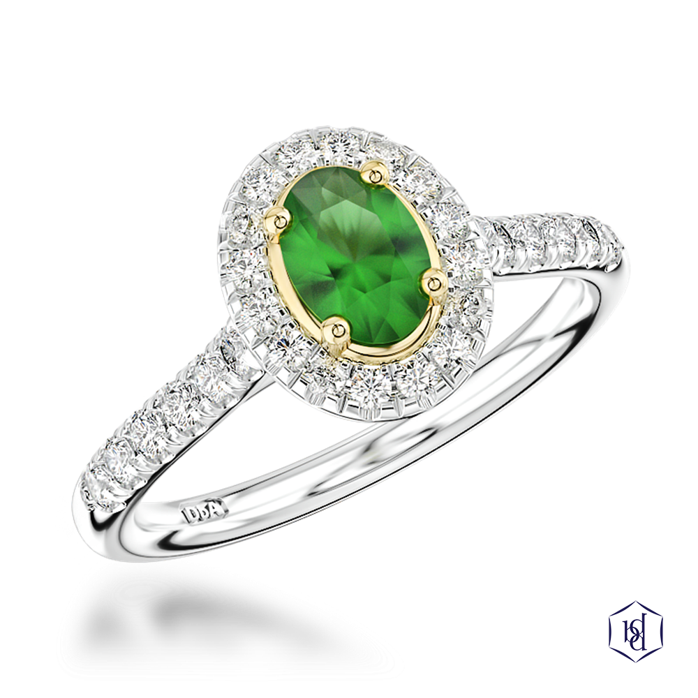 oval cut green tourmaline in a platinum shank and18ct yellow gold head cluster diamond band