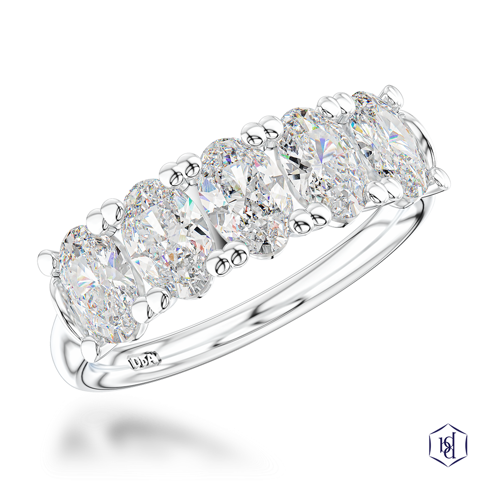 oval cut diamond in a platinum bridal plain band