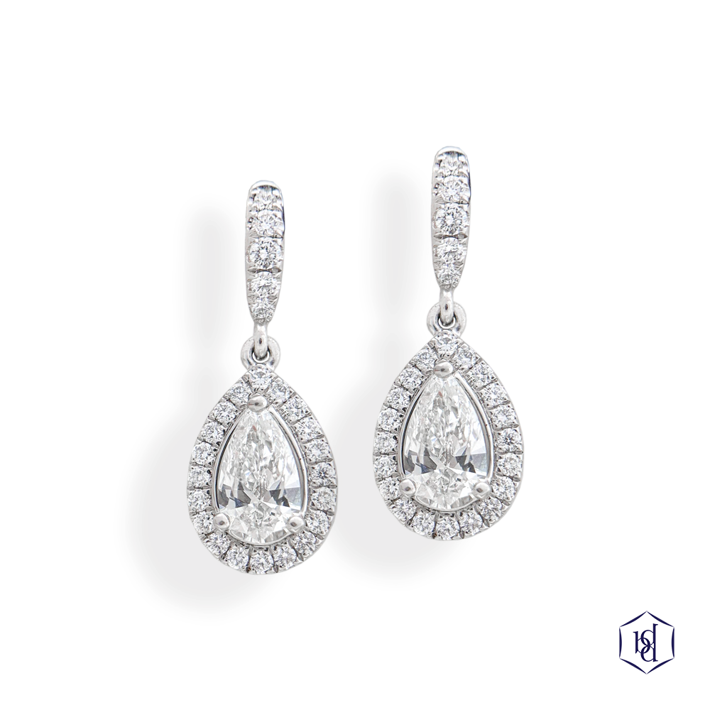 pear shape cut diamond in a platinum earrings cluster